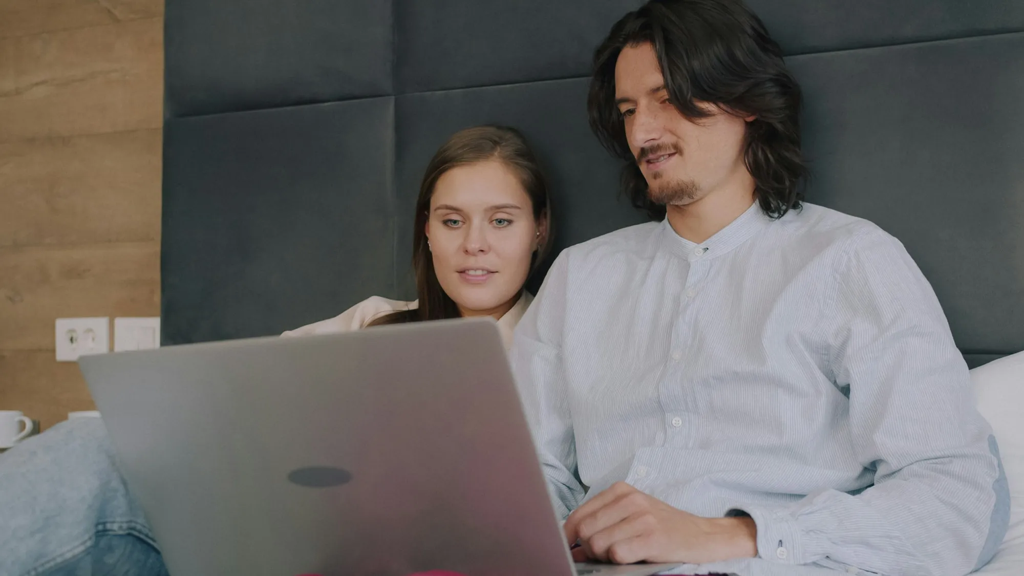 Young couple looking at a laptop together